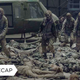 A group of zombies lurch forward in The Walking Dead's season 11 premiere.